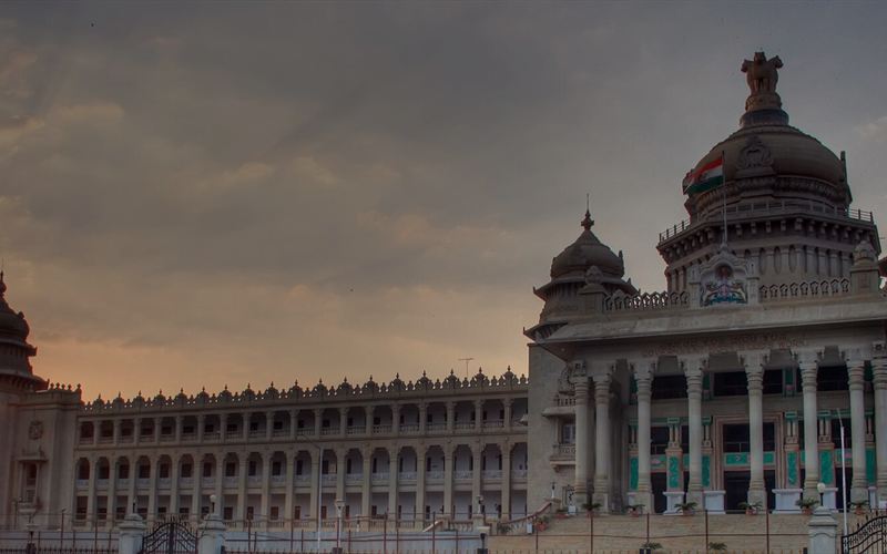 Vidhana Soudha at dusk in Bengaluru, suggesting a local's travel guide to the city